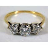 An 18ct gold diamond trilogy ring of 1.2ct size M/