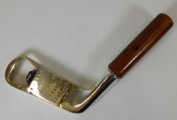 A silver plated golf club bottle opener
