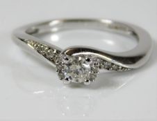 A 9ct white gold ring set with 0.25ct centre diamo