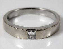 An 18ct white gold solitaire ring set with princes