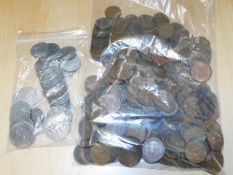 A bagged quantity of copper coinage twinned with a
