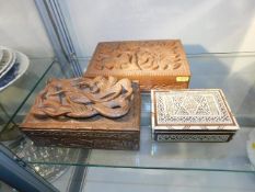 Two carved wooden boxes twinned with an Asian inla