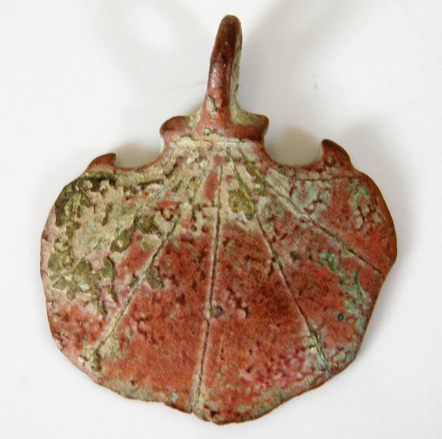 An antiquated Pilgrims pendant, possibly bronze