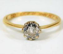 An 18ct gold solitaire set with 0.75ct diamond siz