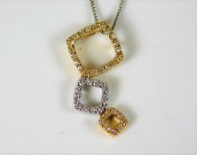 An 18ct gold chain with two colour gold pendant wi