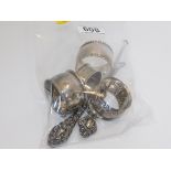 Four silver napkin rings 65g twinned with two silv