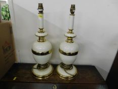 A pair of decorative metal & brass lamps