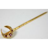 A yellow metal tie pin set with diamond & ruby 2.2