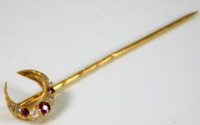 A yellow metal tie pin set with diamond & ruby 2.2