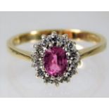 A 9ct gold ring set with pink sapphire & diamond s
