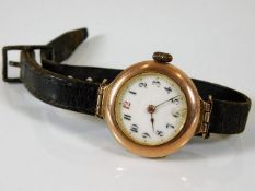 A yellow metal cased watch