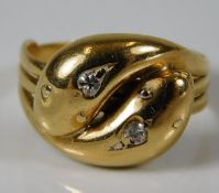 A 19thC. yellow metal double snake ring, tests as 18ct gold, set with diamonds size S 7.3g