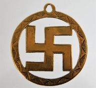 A 9ct gold swastika pendant 2.1g