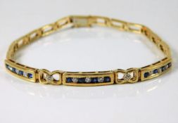 A 9ct gold diamond & sapphire bracelet 10.3g