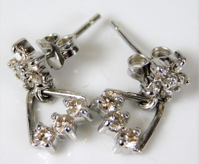 A pair of 18ct white gold earrings set with 0.5ct