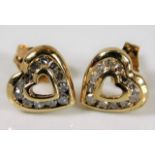 A pair of 9ct gold heart shaped earrings set with