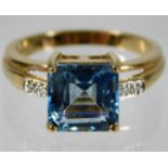 A 9ct gold ring set with topaz & diamond size N/O