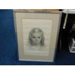 A framed pencil sketch of young girl