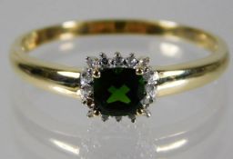 A 9ct gold ring set with tourmaline & diamond size