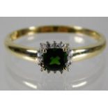 A 9ct gold ring set with tourmaline & diamond size