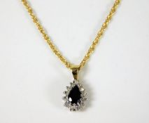 A 9ct gold diamond & sapphire pendant & chain set