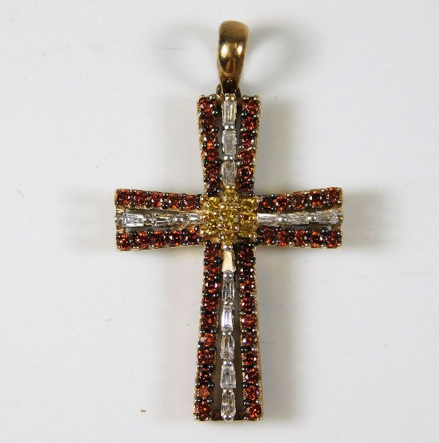 A 9ct gold cross set with white & cinnamon coloure