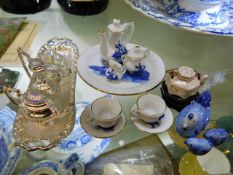 A miniature dolls house porcelain tea set twinned