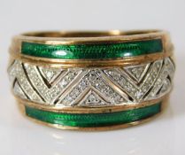 A 9ct gold ring set with diamond within two enamel