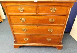 A mahogany chest of drawers with brass fittings