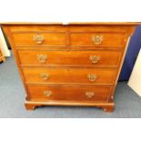 A mahogany chest of drawers with brass fittings