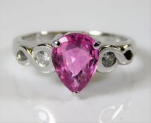 An 18ct white gold pear shaped pink sapphire & dia