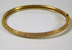 A good quality 18ct gold bangle set with 2ct diamo