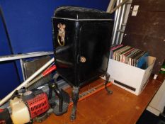 A c.1900 steel cabinet on decorative legs with boa