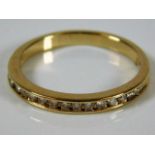 A 14ct gold half eternity ring set with diamonds s