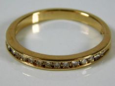 A 14ct gold half eternity ring set with diamonds s