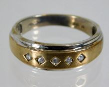 A 9ct gold two tone ring set with diamonds 3.4g si