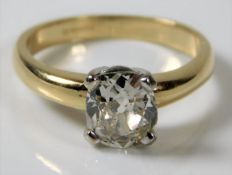 An 18ct gold diamond solitaire ring set with a cus