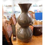 A large retro style vase twinned with a candle hol