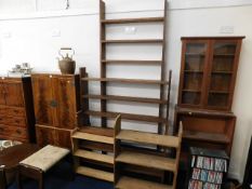 A tall teak bookcase & four other book shelves