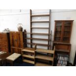 A tall teak bookcase & four other book shelves