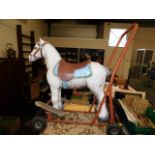 A vintage Triang childs ride along toy horse