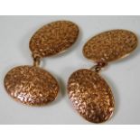 A pair of 9ct gold cufflinks with foliage decor &