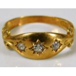 An 18ct gold three stone diamond ring size L 2.9g