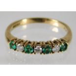 A 9ct gold ring set with emerald & diamond size O