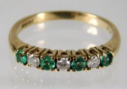 A 9ct gold ring set with emerald & diamond size O