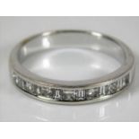 An 18ct white gold half eternity ring set with app