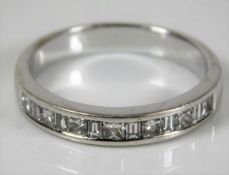 An 18ct white gold half eternity ring set with app