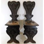 A pair of 19thC. carved oak hall chairs