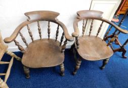 A pair of 19thC. elm smokers armchairs