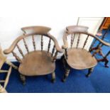 A pair of 19thC. elm smokers armchairs